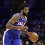 Oct 25, 2025; Philadelphia, Pennsylvania, USA; Philadelphia 76ers center Joel Embiid (21) controls the ball against the Charlotte Hornets during the first quarter at Xfinity Mobile Arena. Mandatory Credit: Bill Streicher-Imagn Images