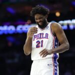 Oct 17, 2025; Philadelphia, Pennsylvania, USA; Philadelphia 76ers center Joel Embiid (21) laughs during a break in action in the first quarter against the Minnesota Timberwolves at Xfinity Mobile Arena. Mandatory Credit: Bill Streicher-Imagn Images