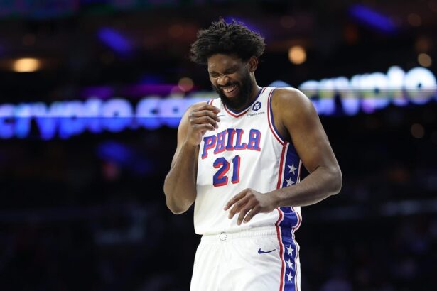 Oct 17, 2025; Philadelphia, Pennsylvania, USA; Philadelphia 76ers center Joel Embiid (21) laughs during a break in action in the first quarter against the Minnesota Timberwolves at Xfinity Mobile Arena. Mandatory Credit: Bill Streicher-Imagn Images