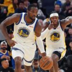 Oct 5, 2025; San Francisco, California, USA; Golden State Warriors forward Jonathan Kuminga (1) dribbles upcourt, as guard Buddy Hield (7) trails, against the Los Angeles Lakers in the third quarter at Chase Center. Mandatory Credit: David Gonzales-Imagn Images