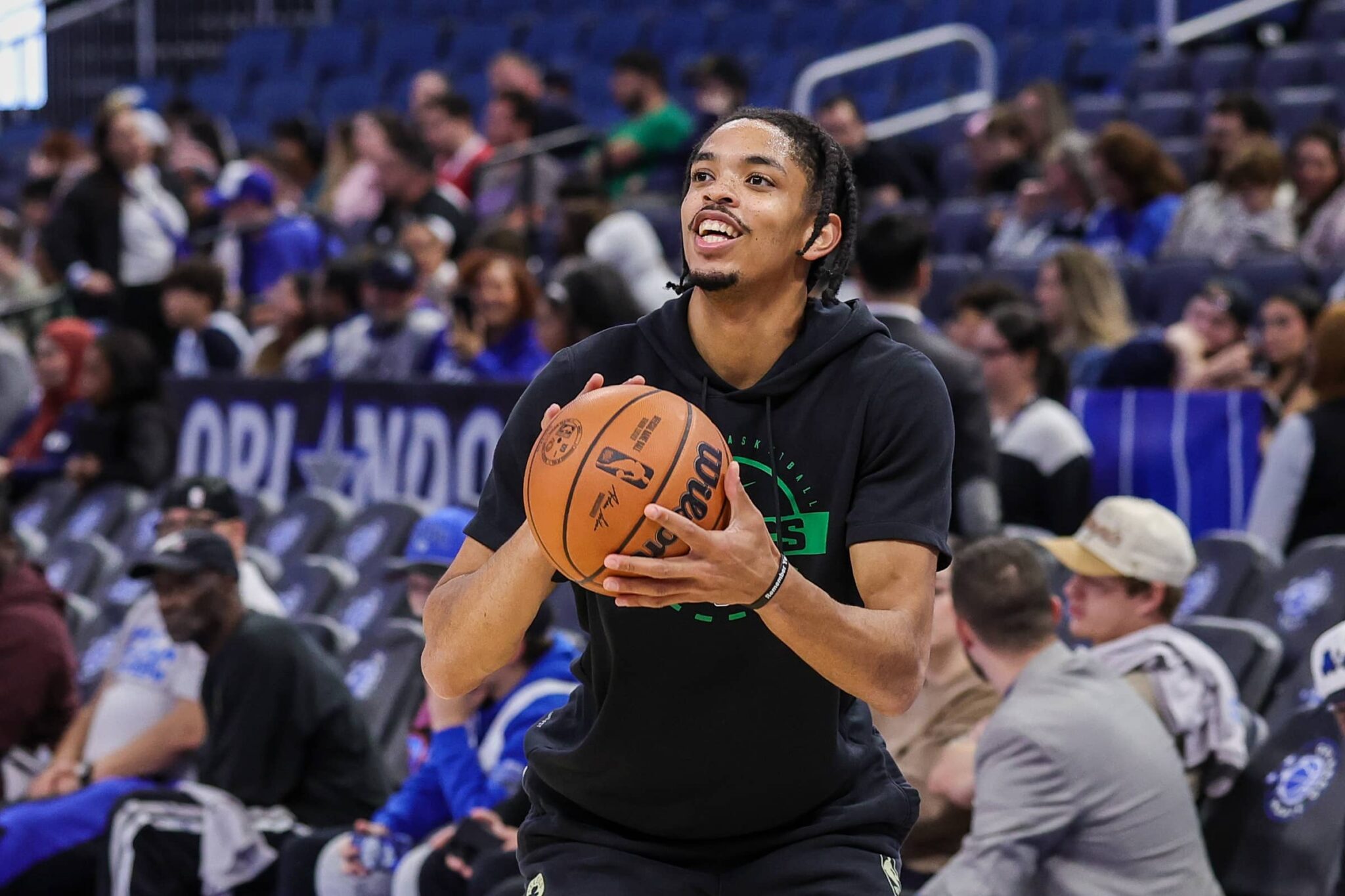 Boston Celtics forward Josh Minott (8) warms up before the game against the Orlando Magic at Kia Center.
