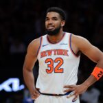 Oct 26, 2025; Miami, Florida, USA; New York Knicks center Karl-Anthony Towns (32) looks on against the Miami Heat during the first quarter at Kaseya Center. Mandatory Credit: Sam Navarro-Imagn Images