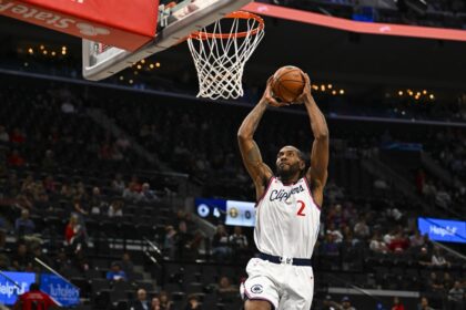 Oct 12, 2025; Inglewood, California, USA; Los Angeles Clippers forward Kawhi Leonard (2) dunks against the Denver Nuggets during the first quarter at Intuit Dome. Mandatory Credit: Jonathan Hui-Imagn Images