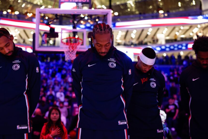 Oct 15, 2025; Sacramento, California, USA; Los Angeles Clippers forward Kawhi Leonard (2) stands during the playing of the national anthem before the game against the Sacramento Kings at Golden 1 Center. Mandatory Credit: Sergio Estrada-Imagn Images