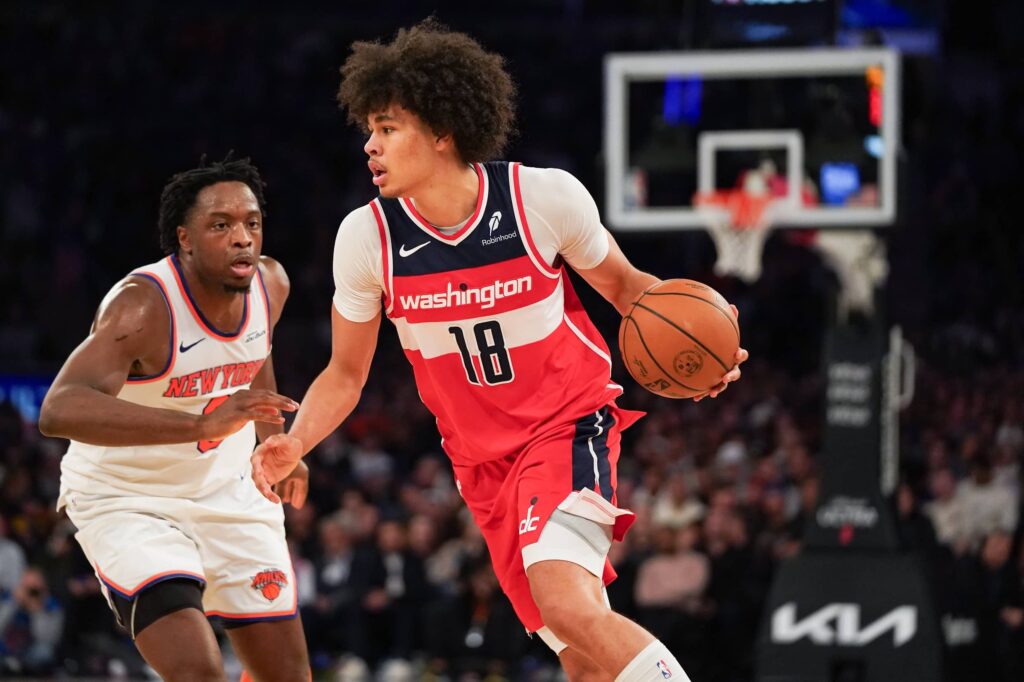 Washington forward Kyshawn George (18) navigates around New York Knicks forward OG Anunoby (8) during the second half at Madison Square Garden.