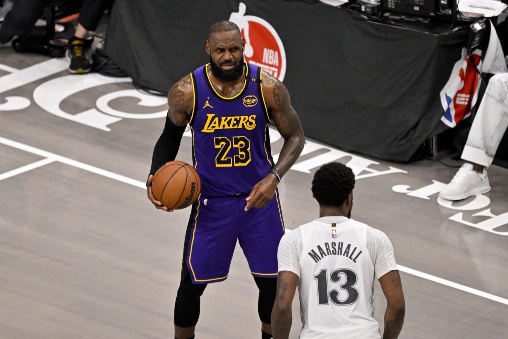 Apr 9, 2025; Dallas, Texas, USA; Los Angeles Lakers forward LeBron James (23) and Dallas Mavericks forward Naji Marshall (13) in action during the game between the Dallas Mavericks and the Los Angeles Lakers at American Airlines Center. Mandatory Credit: Jerome Miron-Imagn Images