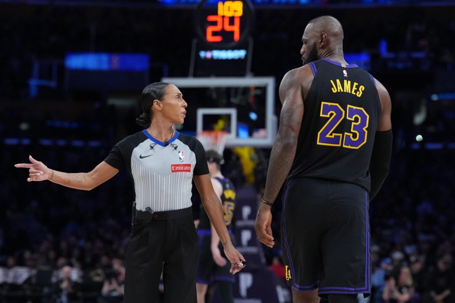 Nov 18, 2025; Los Angeles, California, USA; NBA female referee Sha'rae Mitchell (98) talks with Los Angeles Lakers forward LeBron James (23) in the second quarter of the game against the Utah Jazz at Crypto.com Arena. Mandatory Credit: Kirby Lee-Imagn Images