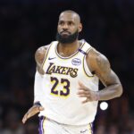 Los Angeles Lakers forward LeBron James (23) reacts after scoring against the Oklahoma City Thunder during the second half at Paycom Center.