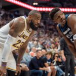 Minnesota Timberwolves guard Anthony Edwards (5) guards Los Angeles Lakers forward LeBron James (23) in the second quarter during game four of first round for the 2025 NBA Playoffs at Target Center.