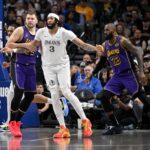 Los Angeles Lakers guard Luka Doncic (77) and forward LeBron James (23) and Dallas Mavericks forward Anthony Davis (3) in action during the game between the Dallas Mavericks and the Los Angeles Lakers at American Airlines Center.