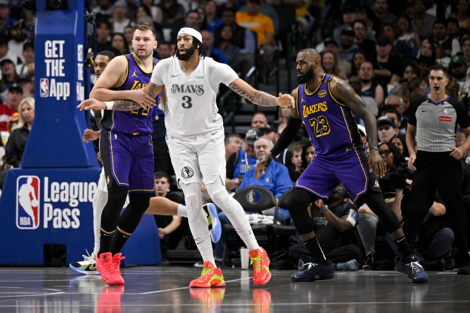 Los Angeles Lakers guard Luka Doncic (77) and forward LeBron James (23) and Dallas Mavericks forward Anthony Davis (3) in action during the game between the Dallas Mavericks and the Los Angeles Lakers at American Airlines Center.