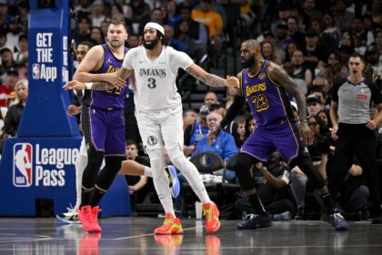 Los Angeles Lakers guard Luka Doncic (77) and forward LeBron James (23) and Dallas Mavericks forward Anthony Davis (3) in action during the game between the Dallas Mavericks and the Los Angeles Lakers at American Airlines Center.