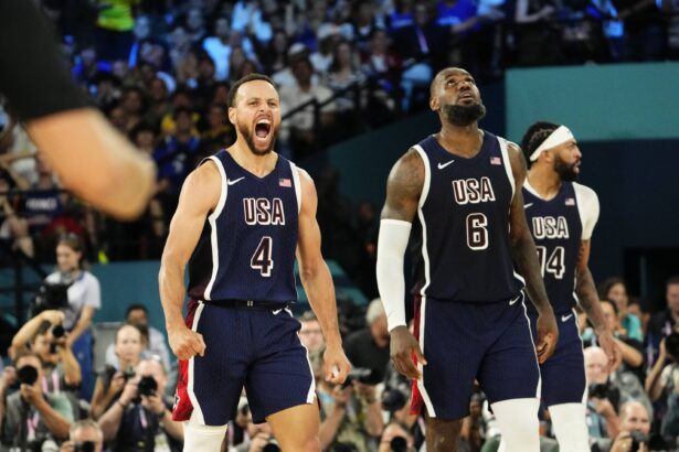 United States shooting guard Stephen Curry (4) and guard LeBron James (6) react in the second half against France in the men's basketball gold medal game during the Paris 2024 Olympic Summer Games at Accor Arena.