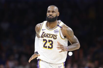 Los Angeles Lakers forward LeBron James (23) reacts after scoring against the Oklahoma City Thunder during the second half at Paycom Center.