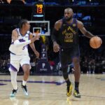 Los Angeles Lakers forward LeBron James (23) dribbles the ball against Utah Jazz forward Cody Williams (5) in the second quarter at Crypto.com Arena.