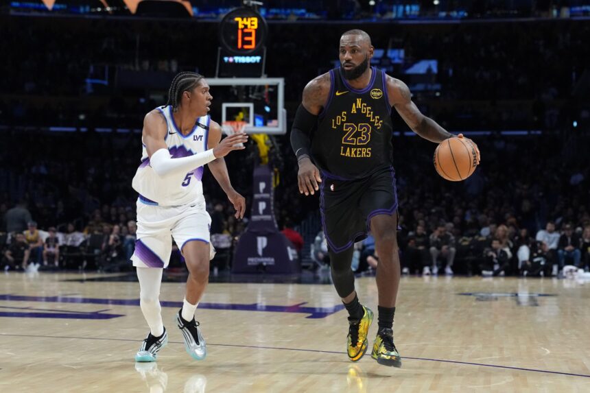 Los Angeles Lakers forward LeBron James (23) dribbles the ball against Utah Jazz forward Cody Williams (5) in the second quarter at Crypto.com Arena.
