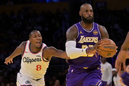 Los Angeles Lakers forward LeBron James (23) drives past Los Angeles Clippers guard Kris Dunn (8) during the first half at Crypto.com Arena.