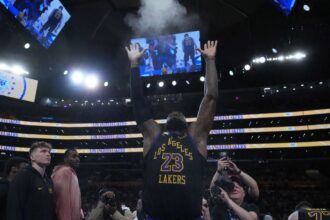 Nov 18, 2025; Los Angeles, California, USA; Los Angeles Lakers forward LeBron James (23) throws powdered chalk into the air during the game against the Utah Jazz at Crypto.com Arena. Mandatory Credit: Kirby Lee-Imagn Images