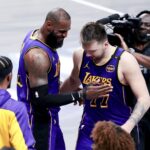 Apr 9, 2025; Dallas, Texas, USA; Los Angeles Lakers forward LeBron James (23) celebrates with Los Angeles Lakers guard Luka Doncic (77) during the fourth quarter against the Dallas Mavericks at American Airlines Center. Mandatory Credit: Kevin Jairaj-Imagn Images