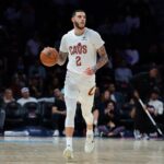 Cleveland Cavaliers guard Lonzo Ball (2) dribbles the basketball against the Miami Heat during the first quarter at Kaseya Center.