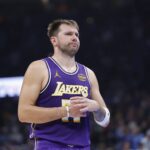 Los Angeles Lakers guard Luka Doncic reacts to a fan during the second quarter of a game against the Oklahoma City Thunder at Paycom Center.