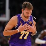 Nov 15, 2025; Milwaukee, Wisconsin, USA; Los Angeles Lakers guard Luka Doncic (77) reacts after scoring a basket during the first quarter against the Milwaukee Bucks at Fiserv Forum. Mandatory Credit: Jeff Hanisch-Imagn Images