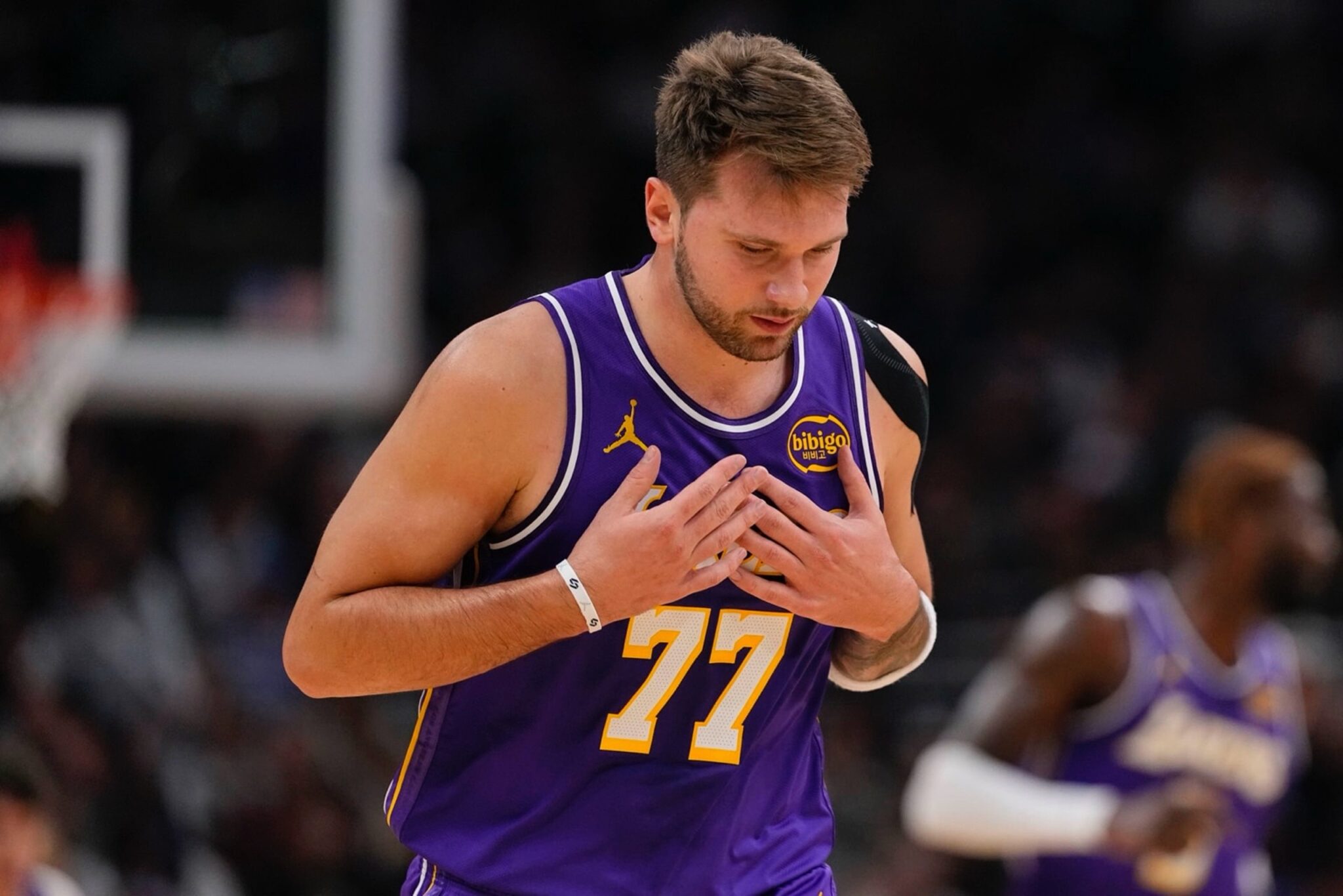Nov 15, 2025; Milwaukee, Wisconsin, USA; Los Angeles Lakers guard Luka Doncic (77) reacts after scoring a basket during the first quarter against the Milwaukee Bucks at Fiserv Forum. Mandatory Credit: Jeff Hanisch-Imagn Images