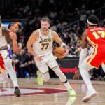 Nov 8, 2025; Atlanta, Georgia, USA; Los Angeles Lakers guard Luka Doncic (77) dribbles against the Atlanta Hawks during the first half at State Farm Arena. Mandatory Credit: Dale Zanine-Imagn Images