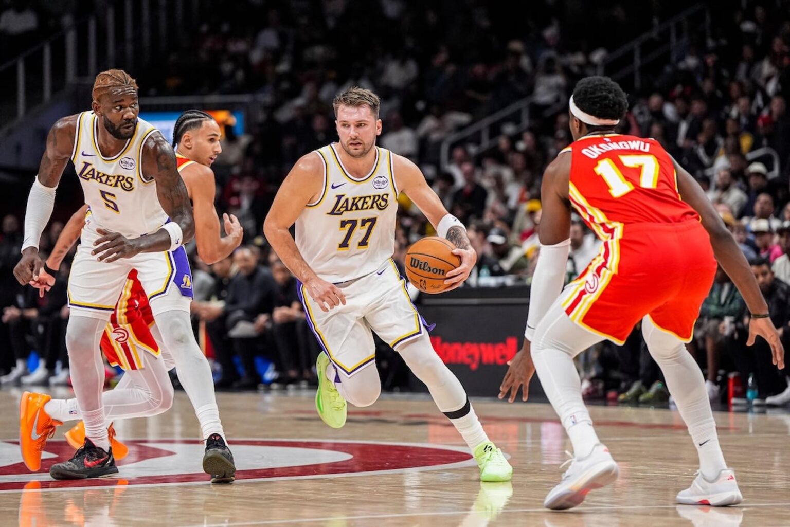 Nov 8, 2025; Atlanta, Georgia, USA; Los Angeles Lakers guard Luka Doncic (77) dribbles against the Atlanta Hawks during the first half at State Farm Arena. Mandatory Credit: Dale Zanine-Imagn Images