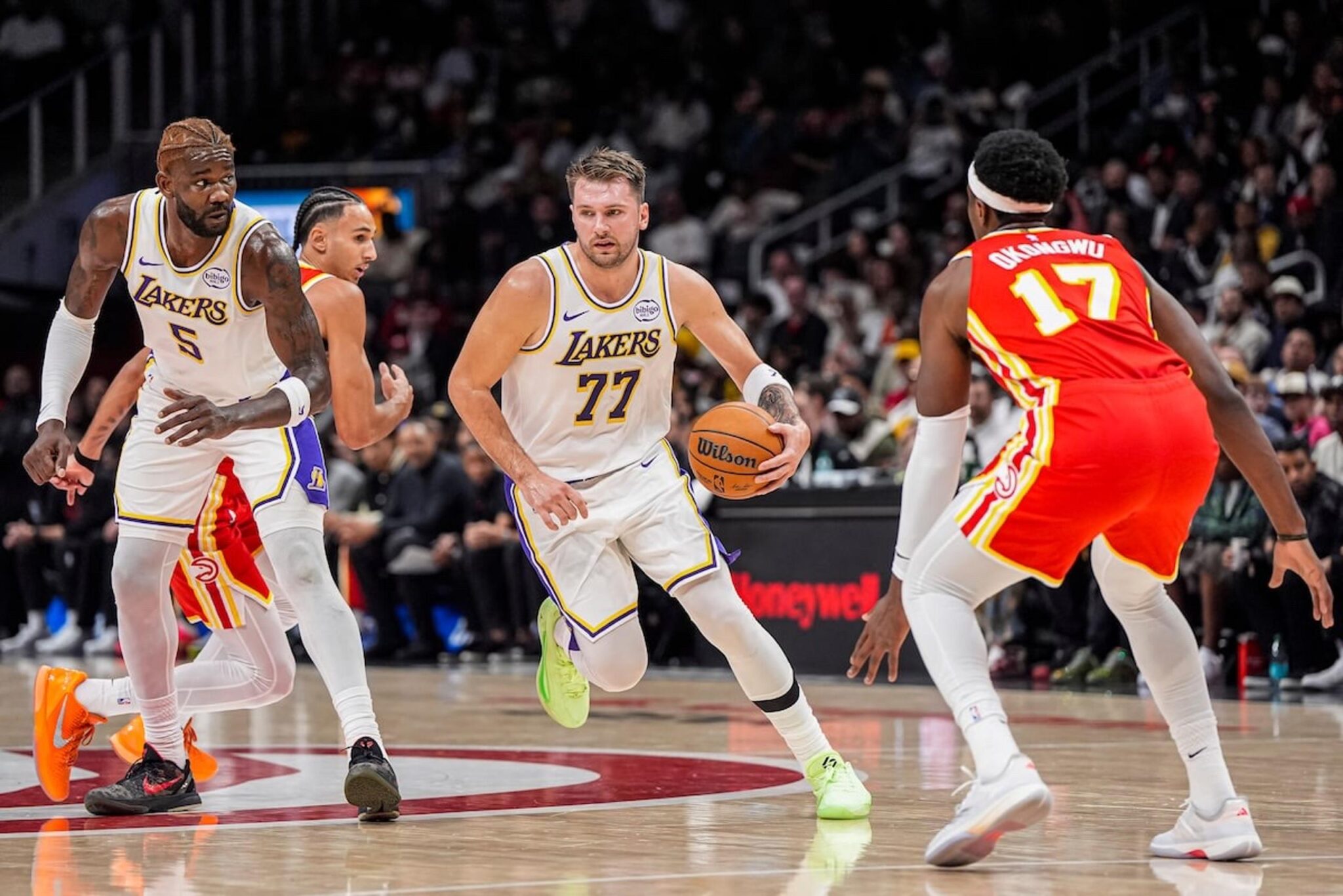 Nov 8, 2025; Atlanta, Georgia, USA; Los Angeles Lakers guard Luka Doncic (77) dribbles against the Atlanta Hawks during the first half at State Farm Arena. Mandatory Credit: Dale Zanine-Imagn Images