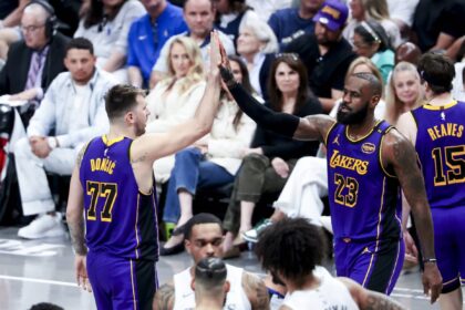 Los Angeles Lakers guard Luka Doncic (77) and forward LeBron James (23) during the second quarter against the Minnesota Timberwolves at Crypto.com Arena.