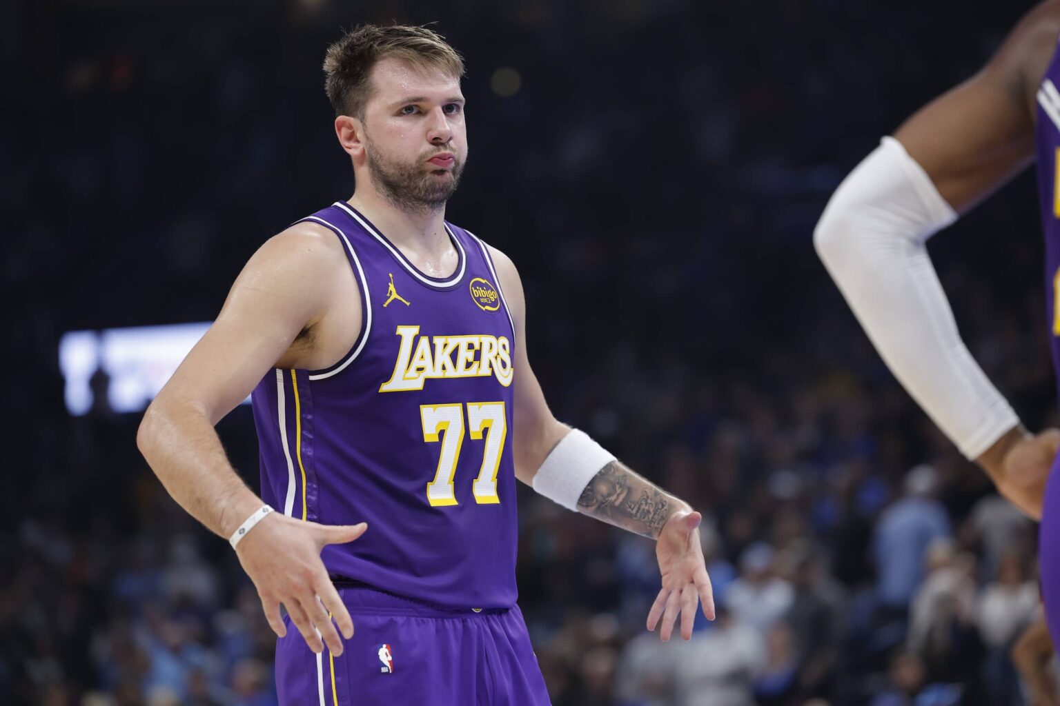 Los Angeles Lakers guard Luka Doncic reacts to a fan during the second quarter of a game against the Oklahoma City Thunder at Paycom Center.