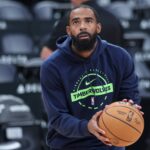 Minnesota Timberwolves guard Mike Conley (10) warms up before the game against the Utah Jazz at Delta Center.