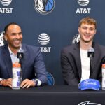 Jun 27, 2025; Dallas, TX, USA; Dallas Mavericks general manager Nico Harrison (left) looks on with Mavericks first overall pick Cooper Flagg (right) at a press conference at the Dallas Mavericks Practice Facility. Mandatory Credit: Jerome Miron-Imagn Images