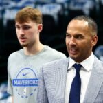 Dallas Mavericks general manager Nico Harrison and Dallas Mavericks forward Cooper Flagg (32) before the game against the San Antonio Spurs at American Airlines Center.