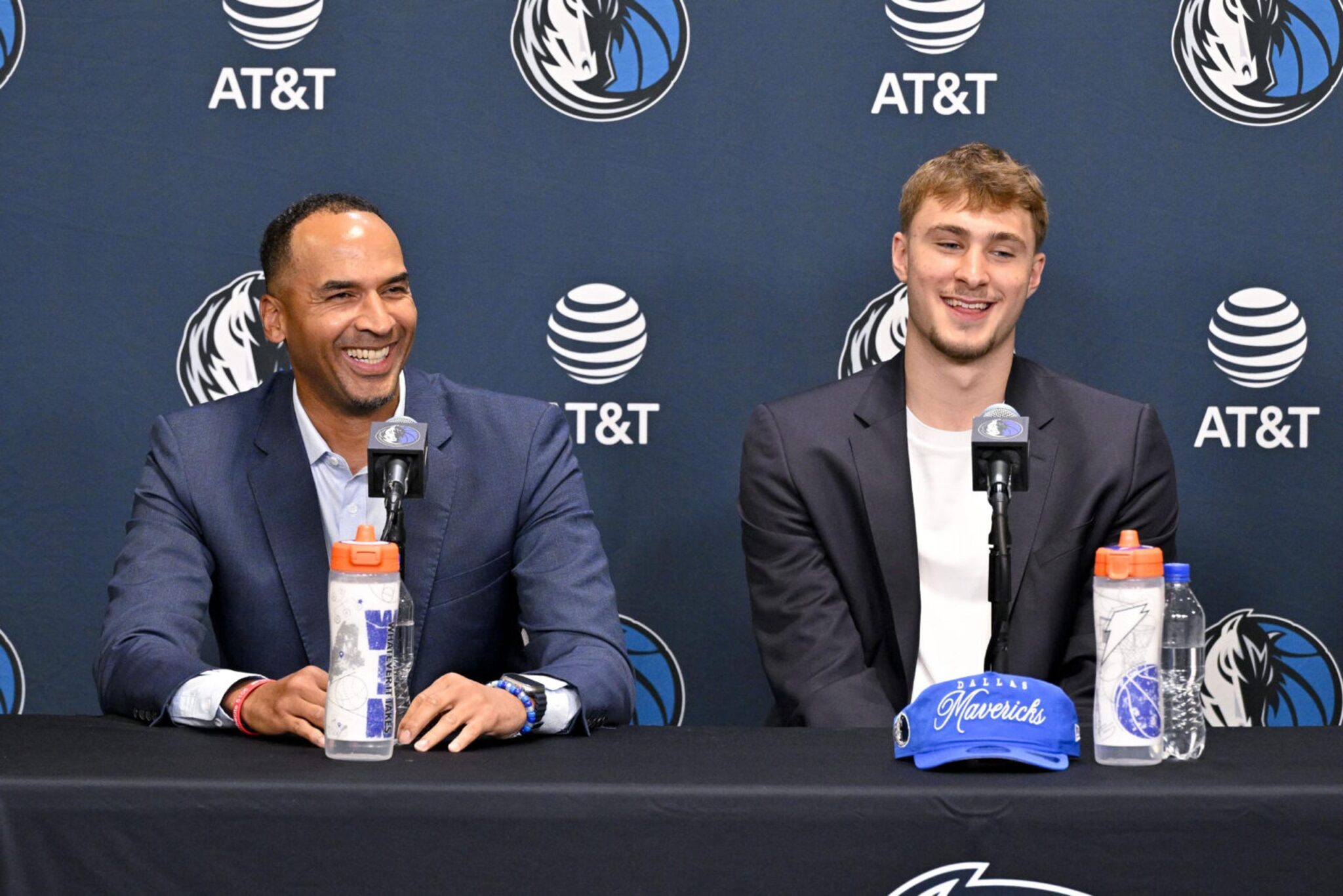 Jun 27, 2025; Dallas, TX, USA; Dallas Mavericks general manager Nico Harrison (left) looks on with Mavericks first overall pick Cooper Flagg (right) at a press conference at the Dallas Mavericks Practice Facility. Mandatory Credit: Jerome Miron-Imagn Images