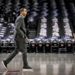 Feb 10, 2025; Dallas, Texas, USA; Dallas Mavericks general manager Nico Harrison walks on to the court before the game between the Dallas and the Sacramento Kings at the American Airlines Center. Mandatory Credit: Jerome Miron-Imagn Images