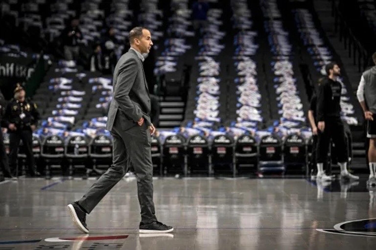 Feb 10, 2025; Dallas, Texas, USA; Dallas Mavericks general manager Nico Harrison walks on to the court before the game between the Dallas and the Sacramento Kings at the American Airlines Center. Mandatory Credit: Jerome Miron-Imagn Images