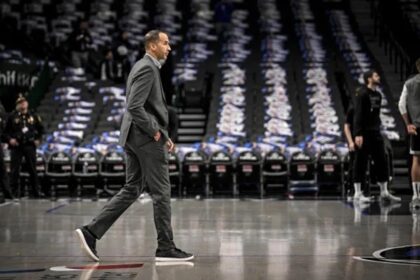 Feb 10, 2025; Dallas, Texas, USA; Dallas Mavericks general manager Nico Harrison walks on to the court before the game between the Dallas and the Sacramento Kings at the American Airlines Center. Mandatory Credit: Jerome Miron-Imagn Images