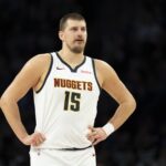 Denver Nuggets center Nikola Jokic (15) looks on against the Minnesota Timberwolves in the second half at Target Center.