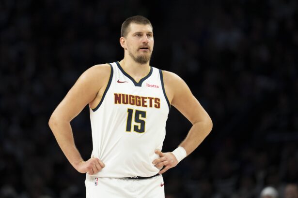 Denver Nuggets center Nikola Jokic (15) looks on against the Minnesota Timberwolves in the second half at Target Center.