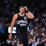 Nov 17, 2025; Denver, Colorado, USA; Denver Nuggets center Nikola Jokic (15) reacts in the second quarter against the Chicago Bulls at Ball Arena. Mandatory Credit: Ron Chenoy-Imagn Images