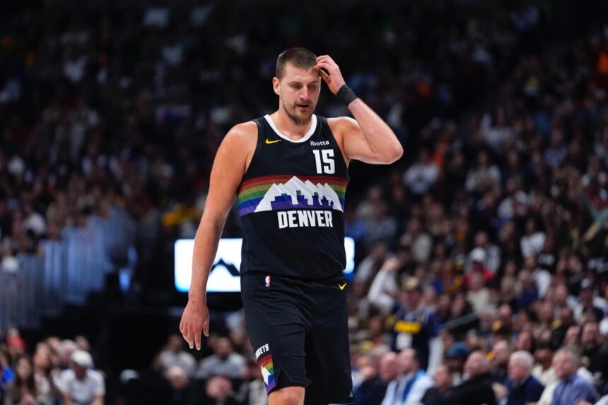 Nov 17, 2025; Denver, Colorado, USA; Denver Nuggets center Nikola Jokic (15) reacts in the second quarter against the Chicago Bulls at Ball Arena. Mandatory Credit: Ron Chenoy-Imagn Images