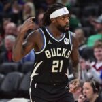 Milwaukee Bucks guard Patrick Beverley (21) reacts after scoring a basket in the third quarter against the Boston Celtics at Fiserv Forum.