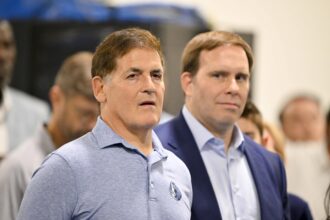 Dallas Mavericks minority owner Mark Cuban (left) and Mavericks governor Patrick Dumont (right) looks on a press conference at the Dallas Mavericks Practice Facility.