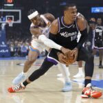 Oklahoma City Thunder guard Shai Gilgeous-Alexander (2) defends a drive by Sacramento Kings guard Russell Westbrook (18) during the first quarter at Paycom Center.
