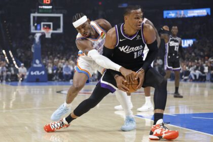 Oklahoma City Thunder guard Shai Gilgeous-Alexander (2) defends a drive by Sacramento Kings guard Russell Westbrook (18) during the first quarter at Paycom Center.