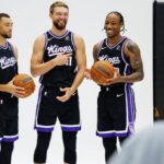 Sacramento Kings guard Zach LaVine (8), forward Domantas Sabonis (11), and forward DeMar DeRozan (10) pose for a photo during media day at Golden 1 Center.