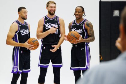 Sacramento Kings guard Zach LaVine (8), forward Domantas Sabonis (11), and forward DeMar DeRozan (10) pose for a photo during media day at Golden 1 Center.