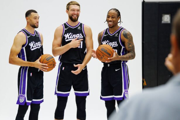 Sacramento Kings guard Zach LaVine (8), forward Domantas Sabonis (11), and forward DeMar DeRozan (10) pose for a photo during media day at Golden 1 Center.